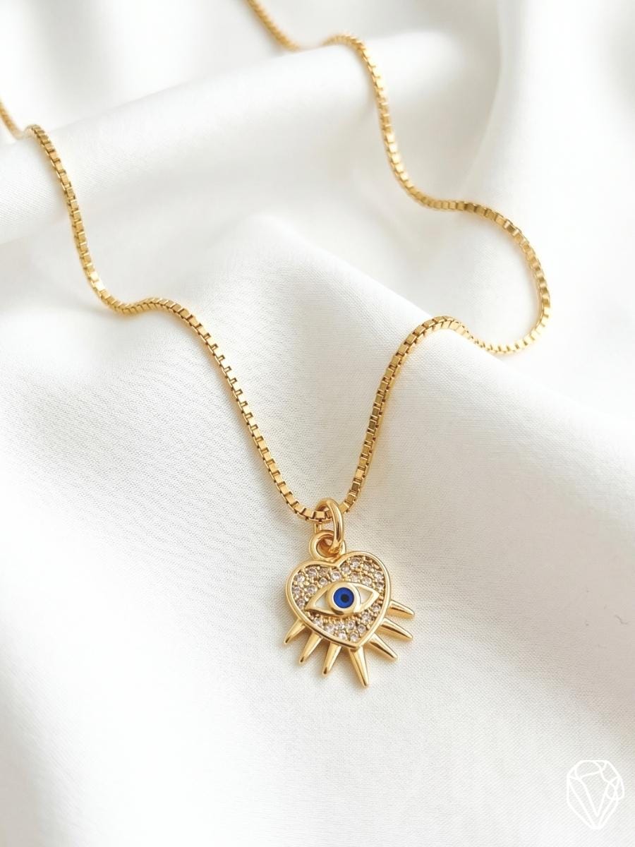 Dije Corazón Ojo — Oro Laminado Americano | Varelis